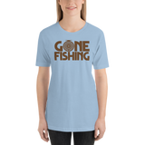 Model wearing women's fishing t shirt with fly fishing reel design and text.